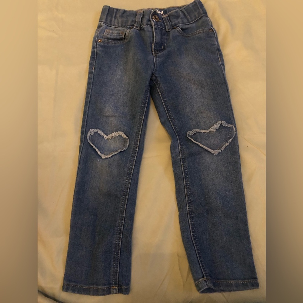 4T skinny jeans with heart detail on knees.